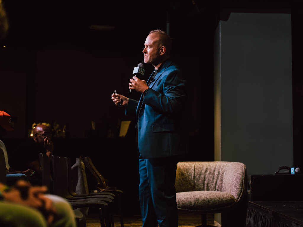 Michael King Jr., founder of Gawker Traffic and Teams.Coach, speaking on stage